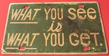 Vintage What You See Is What You Get Booster License Plate PLASTIC picture