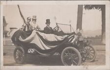 Uncle Sam Riding Patriotic Car Display US Flags Littleton NH 1912 RPPC Postcard picture