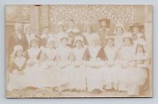 RPPC Postcard Group Photo of Men and Women in Unknown Uniforms or Costumes picture