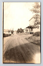 RPPC Street View Homes of Unknown Town Near Water Dirt Road Trees Postcard picture