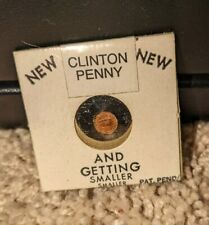 NIXON PENNY AND GETTING SMALLER NOVELTY PENNY W. CLINTON STICKER OVER.  picture