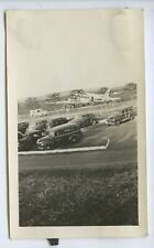 SNAPSHOT from Album * Parking lot with cars Airplane in back being loaded picture