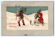 1911 Christmas Greetings Boy Pulling Cart Girl Warmer Embossed Antique Postcard picture