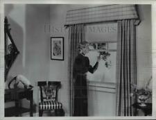 1950 Press Photo Woman Pulling Plastic Home Window Shade  - nee26120 picture