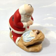 Kneeling Santa Praying Over Baby Jesus Porcelain Figure Ornament 1985 picture