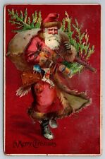 A Merry Christmas Santa Claus Toys Tree c1910 Postcard picture