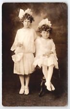 RPPC Two Edwardian Girls White Costume Hair Bows Leaf Crowns Studio Postcard Q24 picture