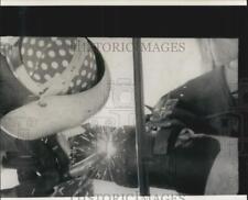 1969 Press Photo Freeport Sulphur Company welder works on a pipeline for a mine picture
