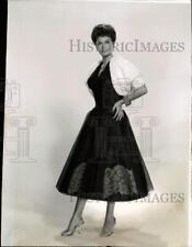 1957 Press Photo Actress Eva Bartok models black short-length evening gown in CA picture
