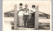 PEOPLE AT FENCE c1910 real photo postcard rppc interesting candid portrait picture