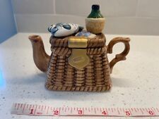 Teapot Shaped Like Fishing Basket Figurine picture