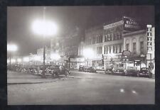 REAL PHOTO ELYRIA OHIO DOWNTOWN STREET SCENE AT NIGHT STORES POSTCARD COPY picture