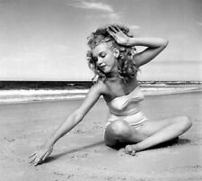 MARILYN MONROE - SITTING ON THE SAND AT THE BEACH IN A ONE PIECE  picture