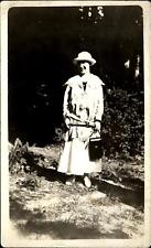 RPPC 1904-1920s ~ woman outdoors ~ Photographer? Antique postcard camera case? picture