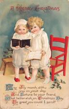 CHILDREN CHRISTMAS HOLIDAY ARTIST SIGNED CLAPSADDLE EMBOSSED POSTCARD 1915 picture