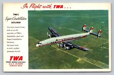 In Flight w/ TWA Super-Constellation Skyliner Classic Airplane VINTAGE Postcard picture