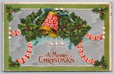 A Merry Christmas Embossed Antique Postcard w/Holly & Bell c1909 picture