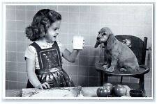 c1930's Cute Girl And Dog Baking Milk North Shore Animal League Vintage Postcard picture