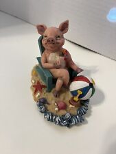 A Little Old Retired Pig Resting At The Beach Figurine picture
