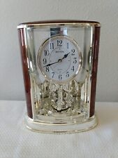 Rhythm Quarts Clock 4SG724, With Moving Crystals At Bottom Brown & Gold Tone.... picture