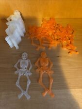 Halloween Lot 04- 10 Orange Hanging Skeletons, 17 Clear Hanging Skeletons picture