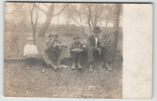 Postcard RPPC Man With Sons Having Snack Sitting on a Log in Tennessee 1908 picture