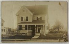 RPPC ~ two story house with a young little girl at the bottom right picture