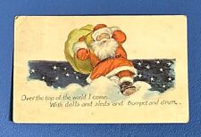 CHRISTMAS Postcard • Santa with Toy Presents Bag Clouds Stars • Posted 1922 picture