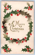 1910's MERRY CHRISTMAS EMBOSSED HOLLY WREATH BERRIES GOLD METALLIC POSTCARD picture