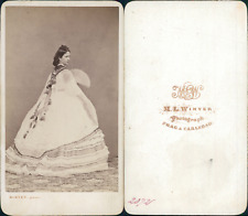 Winter, Prague & Carslbad, woman with crinoline back, cape and fan, circa 1865 picture