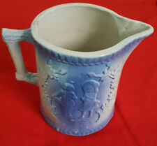 Antique Mid Nineteenth Century Blue Embossed Stoneware Pitcher. Courting Couple picture