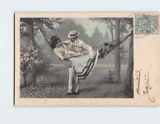 Postcard Vintage Photo of a Woman in a Hammock with a Man Standing Behind Her picture