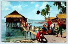 Fisherman preparing for work native huts PHILIPPINES Postcard picture
