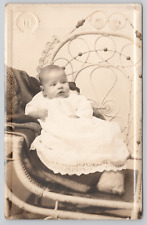 RPPC Baby In White Gown In Studio c1910  Real Photo Postcard picture