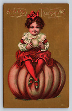 Unposted Gilt Antique PC Victorian Sweet Girl Eating Thanksgiving Jumbo Pumpkin picture