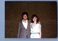 FOUND COLOR PHOTO C+8304 MAN IN SUIT POSED WITH ARM AROUND PRETTY WOMAN picture