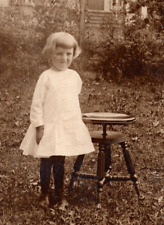 RPPC Young Girl Stands Beside Classic Piano Spinning Stool VINTAGE Postcard picture