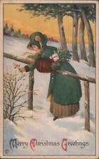 XMAS 1921 A Woman in the Snow Picking Holly Postcard 1c stamp Vintage Post Card picture