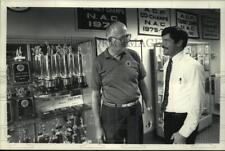 1989 Press Photo Al White and John Denio stand in front of trophy case, Albany picture