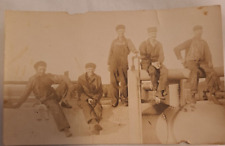 RPPC Postcard 5 Oil Workers Sitting on Riveted Tanks Railroad Hats Work Clothes picture
