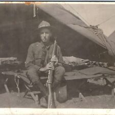 c1910s WWI Young USMC / Army Soldier Gun RPPC Barracks Cot Rifle Fort Photo A154 picture