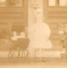 RPPC  Creepy Young Girl With Dolls in Carriage  Real Photo  Postcard  c1915 picture