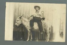 Kenefic OKLAHOMA RPPC 1912 COWBOY Burro Donkey HOLDING PISTOLS nr Durant Caddo picture