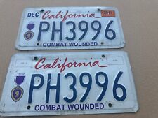Damaged Pair Of Expired California Purple Heart License Plates. picture