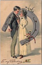 1907 VALENTINE'S DAY Postcard Young Man and Woman / Silver Horseshoe / Glitter picture