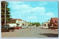 c1950's Land O' Lakes Wisconsin Main Street Classic Cars Parking Stores Postcard picture