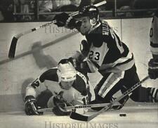 1991 Press Photo Milwaukee Admiral's Shaun Clouston gets run off the puck picture