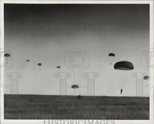 1969 Press Photo Parachutists Dropping From the Sky Onto an Open Field picture
