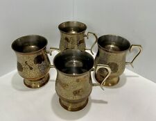 Set pf 4 ornate engraved brass & silver tone mugs. picture