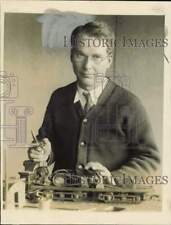 1928 Press Photo Harvard chemist Dr. Albert Coolidge displays a model locomotive picture
